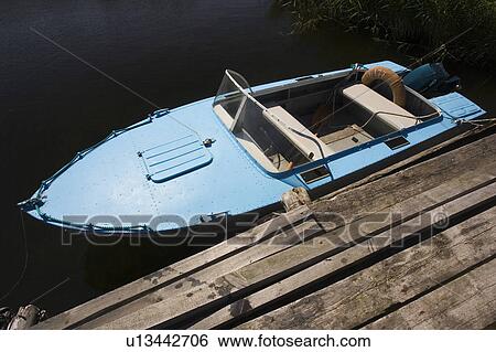 Stock Photograph - Powerboat, Jetty. Fotosearch