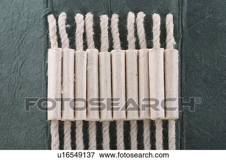 Stock Photo - rope, cord, twine, cardboard, green board, device. Fotosearch