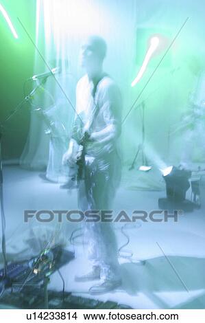 Picture - singer, microphone, rock and roll, sing, singing, stage. Fotosearch