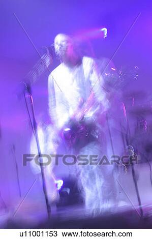 Stock Image - singer, microphone, rock and roll, sing, singing, stage. Fotosearch