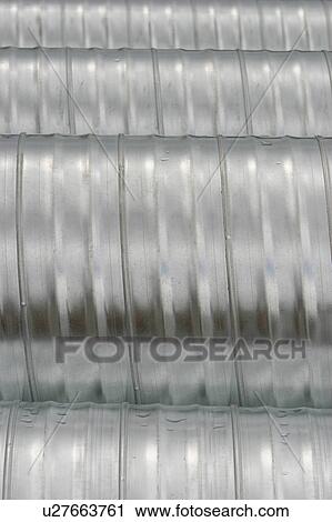 Stock Image - tube, tubing, cylindrical, metal drum, metal tube, surface. Fotosearch
