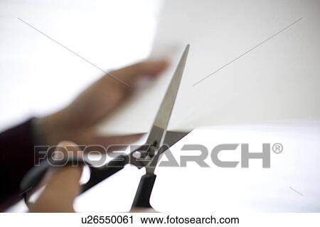 Stock Image - Cutting paper. Fotosearch