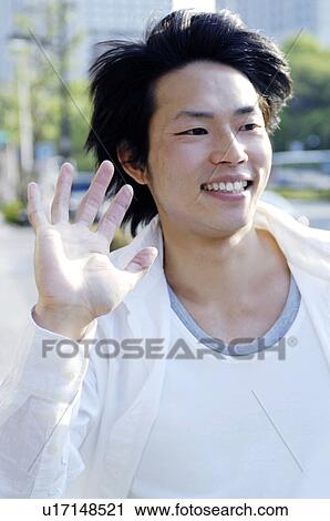 Stock Image - Man waving. Fotosearch