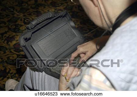 Man typing on and using an augmentative communication devise. View Large Photo Image Stock Image - Man typing on and using an augmentative communication devise.. Fotosearch