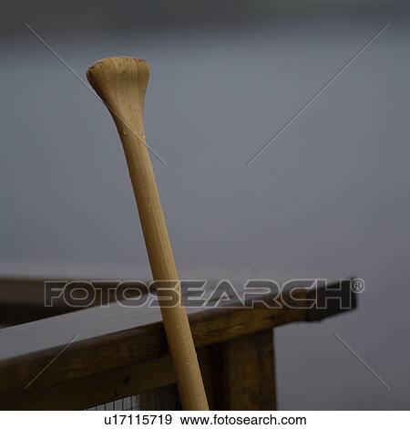 A boat oar leaning against a wooden structure View Large Photo Image Stock Photo - A boat oar leaning against a wooden structure. Fotosearch