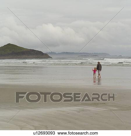 Adult walking with child on beach, Pacific Rim Park, Vancouver Island, Canada View Large Photo Image Stock Image - Adult walking with child on beach, Pacific Rim Park, Vancouver Island, Canada. Fotosearch