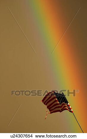 American flag swaying under a rainbow View Large Photo Image Picture - American flag swaying under a rainbow. Fotosearch