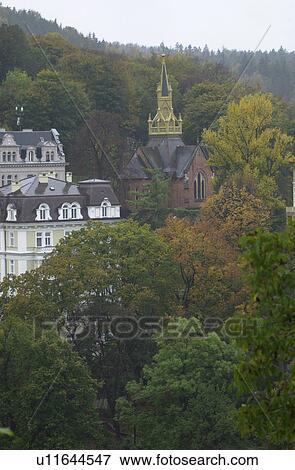 Ancient buildings with trees around in Prague View Large Photo Image Stock Photo - Ancient buildings with trees around in Prague. Fotosearch