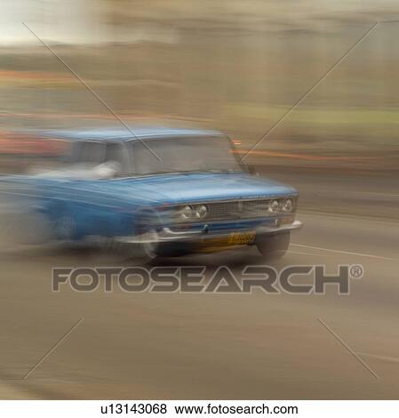 Stock Photo - Blurred view of a car on a road, Havana, Cuba. Fotosearch