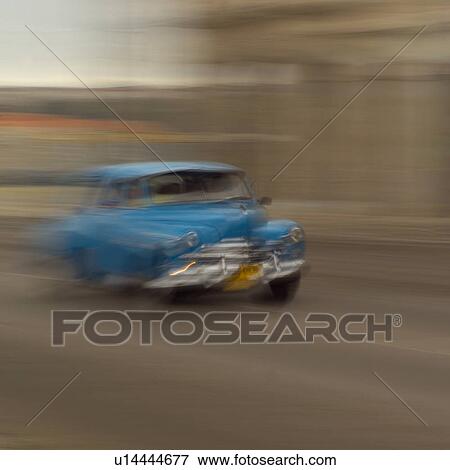 Blurred view of a car on a road, Havana, Cuba View Large Photo Image Stock Photo - Blurred view of a car on a road, Havana, Cuba. Fotosearch