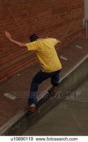 Boy on a skateboard View Large Photo Image Stock Photo - Boy on a skateboard. Fotosearch