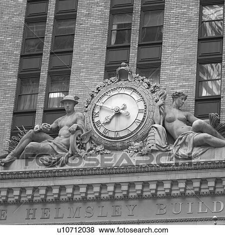 Stock Photo - Clock and sculpture on Helmsley Building, New York City. Fotosearch