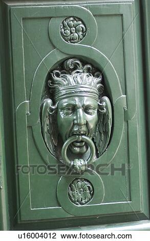 Stock Image - Close-up of a door handle of a building in Paris, France. Fotosearch