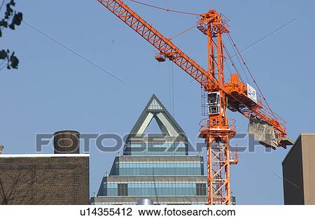 Construction crane at work in Montreal, Canada View Large Photo Image Stock Image - Construction crane at work in Montreal, Canada. Fotosearch