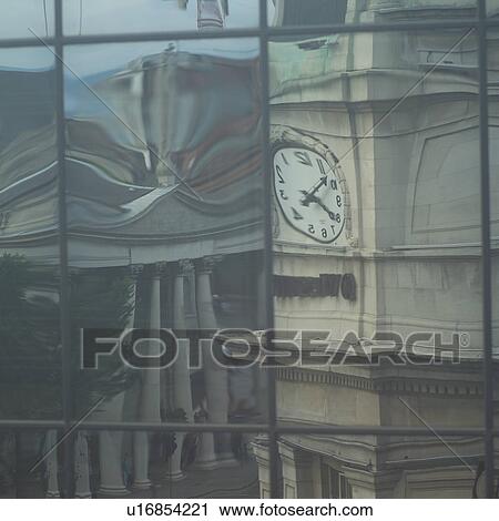 Stock Image - Dublin, Ireland -clock in reflection. Fotosearch