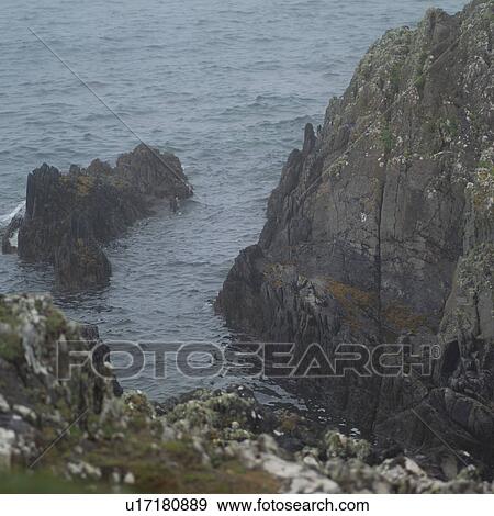 Stock Photo - Ireland - Ring of Kerry - Rocky cliff into ocean. Fotosearch