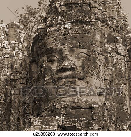 Stock Image - Large Buddha statue at the Khmer Kingdom palace ruins. Fotosearch
