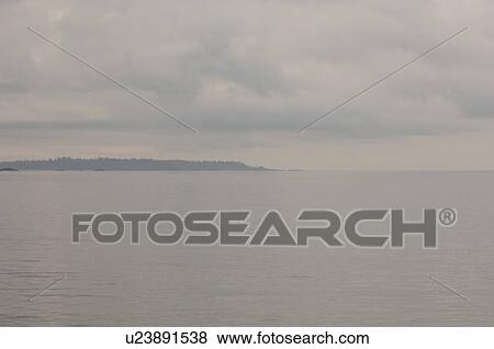 Stock Photo - Low dark cloud over ocean, Pacific Rim National Park, Vancouver Island, Canada. Fotosearch