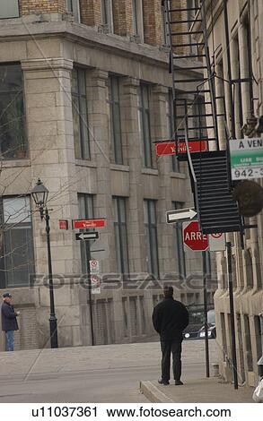 Rear view of a man standing on the side walk in Montreal, Canada View Large Photo Image Stock Image - Rear view of a man standing on the side walk in Montreal, Canada. Fotosearch
