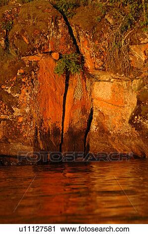 Rock at waters edge View Large Photo Image Stock Image - Rock at waters edge. Fotosearch