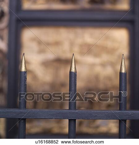 Spikes on fencing protecting carved church door in San Francisco View Large Photo Image Stock Image - Spikes on fencing protecting carved church door in San Francisco. Fotosearch