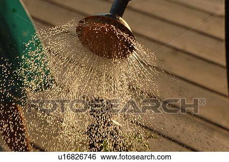 Stock Photograph - Spray of water coming out of nozzle. Fotosearch