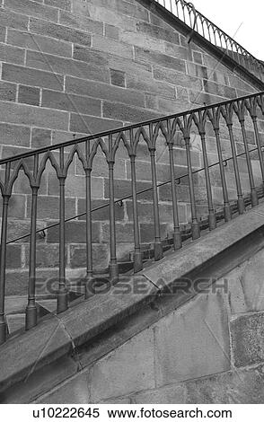 Stock Photography - Stair case with a metal hand rail in Prague. Fotosearch