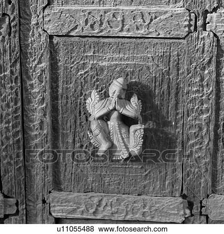 Statue carved on exterior wall of Buddhist Monastery View Large Photo Image Stock Photo - Statue carved on exterior wall of Buddhist Monastery. Fotosearch