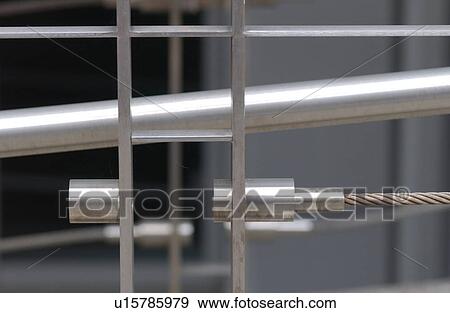 Stock Photo - Steel cables and rods of a railing on a building in Montreal, Canada. Fotosearch