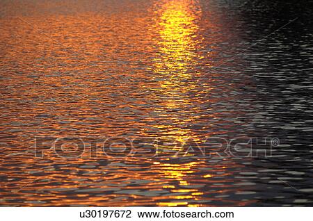 Sunlight on the lake at twilight View Large Photo Image Stock Image - Sunlight on the lake at twilight. Fotosearch