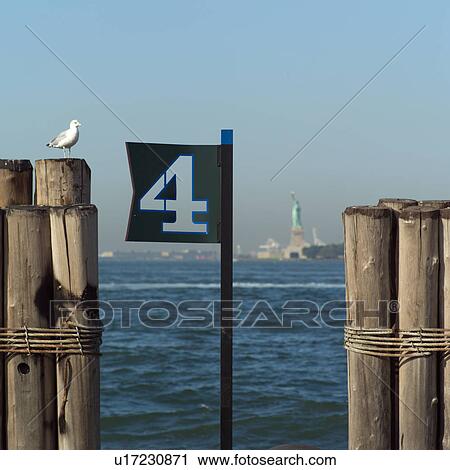 View of Statue of Liberty from Admiral Dewey Promenade, Battery Park, New York City View Large Photo Image Stock Image - View of Statue of Liberty from Admiral Dewey Promenade, Battery Park, New York City. Fotosearch