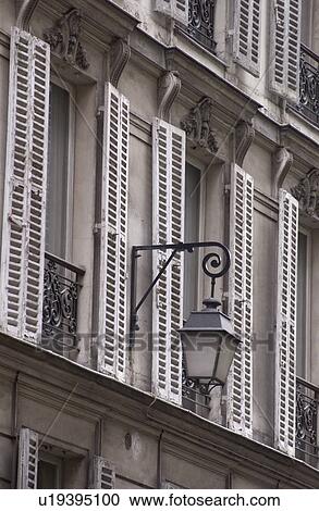 Stock Image - Windows of a building in Paris, France. Fotosearch