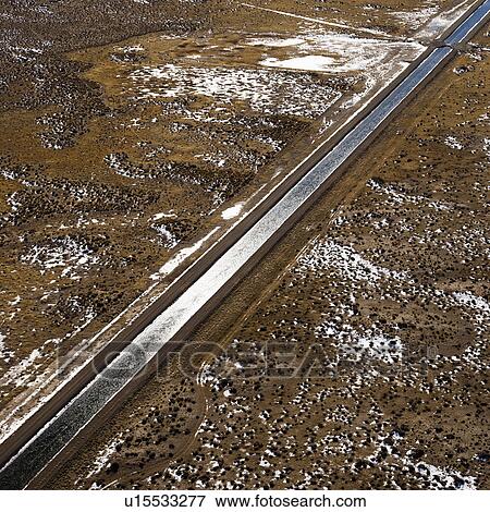Stock Photo - Aerial landscape of water canal running though rural Colorado. Fotosearch