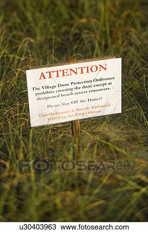 Stock Image - Beach access stay off dunes warning sign. Fotosearch