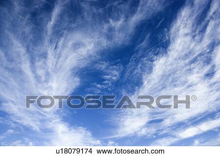 Beautiful blue sky with light wispy clouds View Large Photo Image Picture - Beautiful blue sky with light wispy clouds. Fotosearch