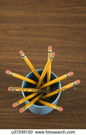 Stock Image - Bird's eye view of wooden pencils in cup. Fotosearch