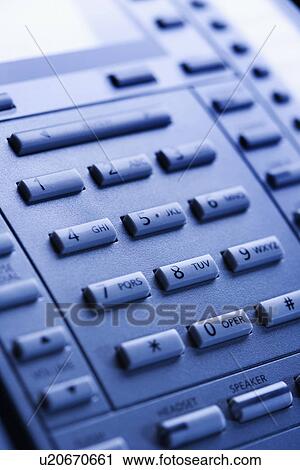 Stock Image - Close-up of a business telephone keypad. Fotosearch