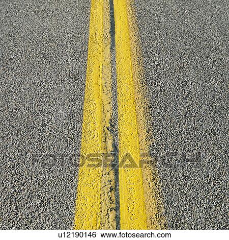 Stock Photograph - Close-up of double yellow lines in road. Fotosearch