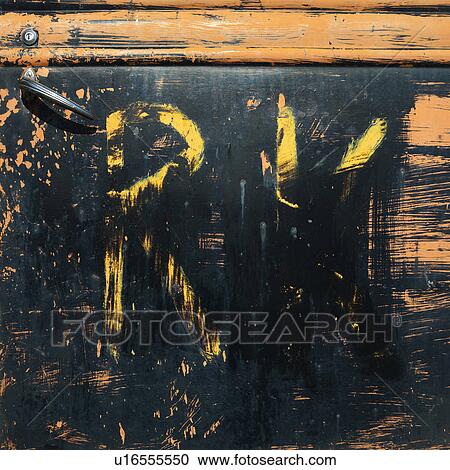 Stock Image - Close-up of scratched up door on old pick-up truck. Fotosearch