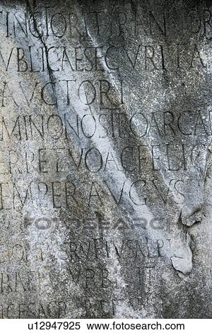 Stock Photography - Close-up of script engraved into stone at the Roman Forum in Rome, Italy. Fotosearch