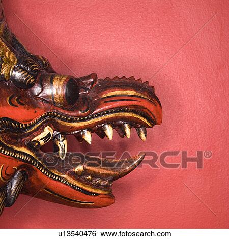 Stock Photograph - Close up of unique Asian style dragon mask. Fotosearch