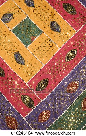 Picture - Colorful Mexican fabric with leaf pattern. Fotosearch