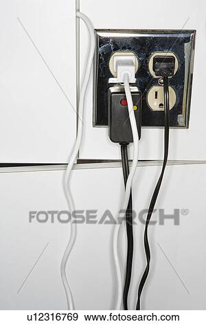 Electrical outlet with multiple plugs and cords View Large Photo Image Stock Photo - Electrical outlet with multiple plugs and cords. Fotosearch
