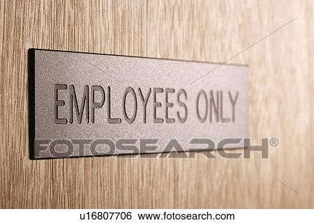 Stock Photograph - Employees only sign on wooden door. Fotosearch