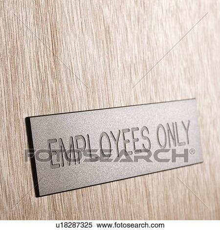 Stock Photography - Employees only sign on wooden door. Fotosearch