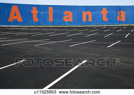 Stock Image - Empty parking lot with Atlanta painted on wall in Atlanta, Georgia. Fotosearch