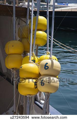Picture - Floating markers on fishing boat. Fotosearch