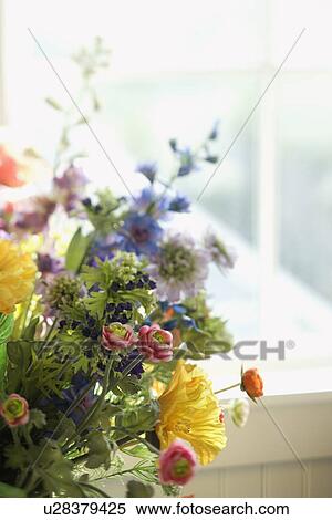Flower arrangement in front of window View Large Photo Image Stock Photography - Flower arrangement in front of window. Fotosearch