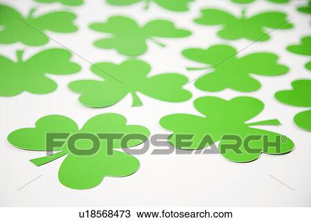 Group of green paper shamrocks on white View Large Photo Image Stock Image - Group of green paper shamrocks on white. Fotosearch