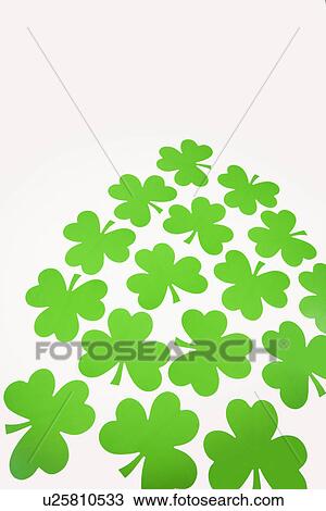 Group of green paper shamrocks on white View Large Photo Image Stock Image - Group of green paper shamrocks on white. Fotosearch